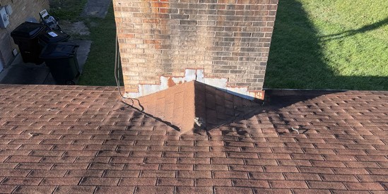 Old chimney flashing separated from the brick before repair